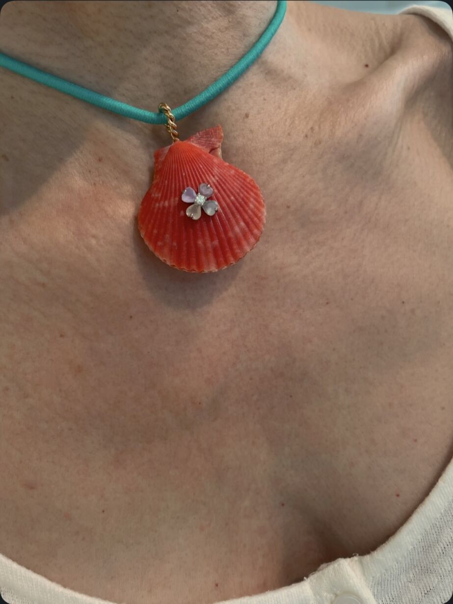 Orange shell pendant by Sande paris.